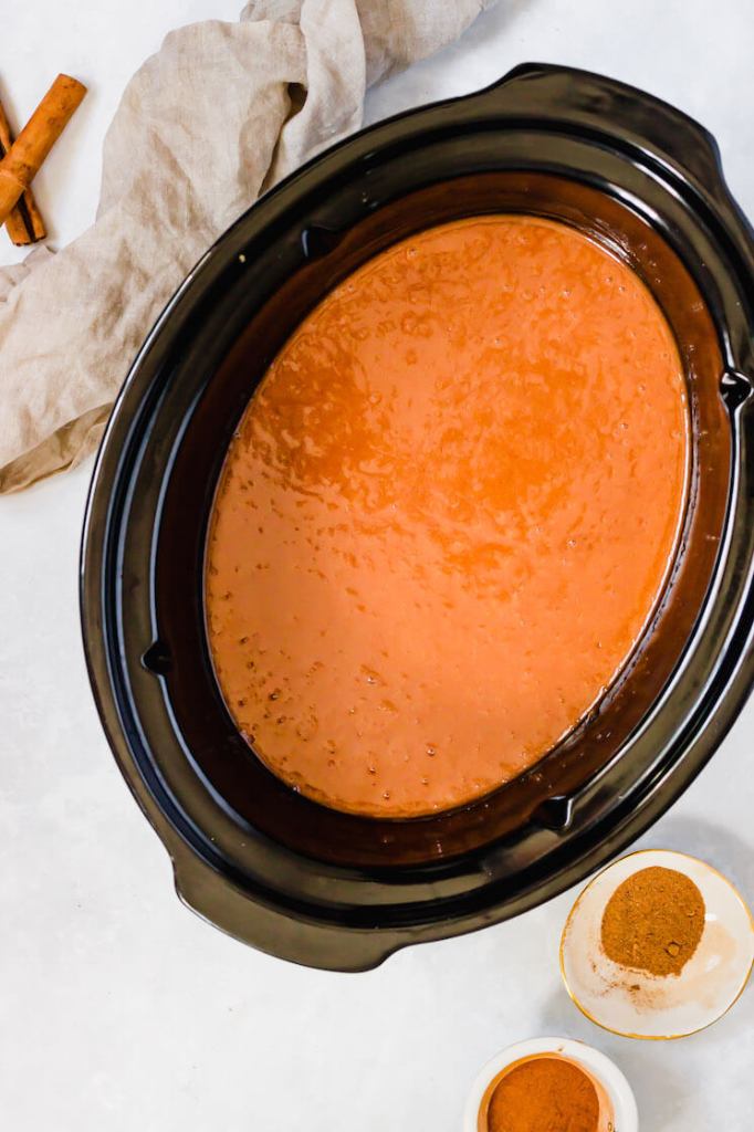 A crockpot filled with homemade apple butter.