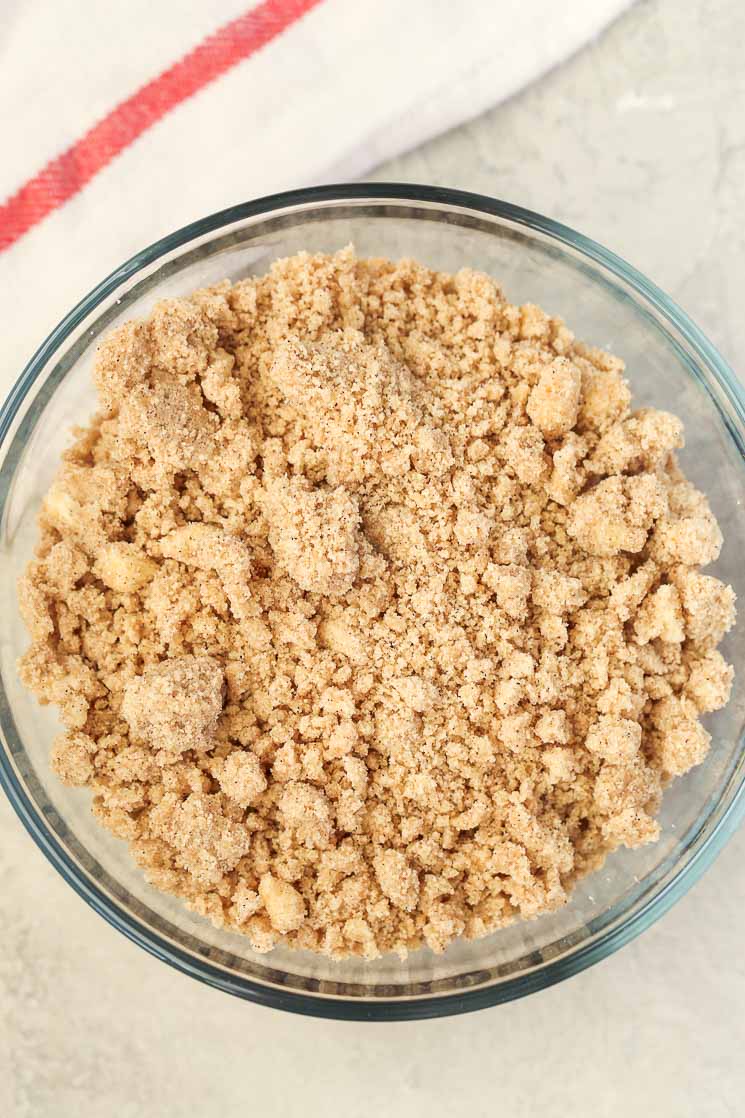 Overhead view of streusel topping in a glass dish. 