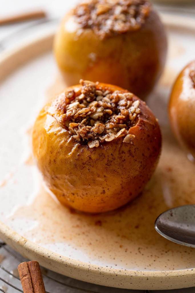 Cinnamon baked apples that have been stuffed with an oat mixture. 