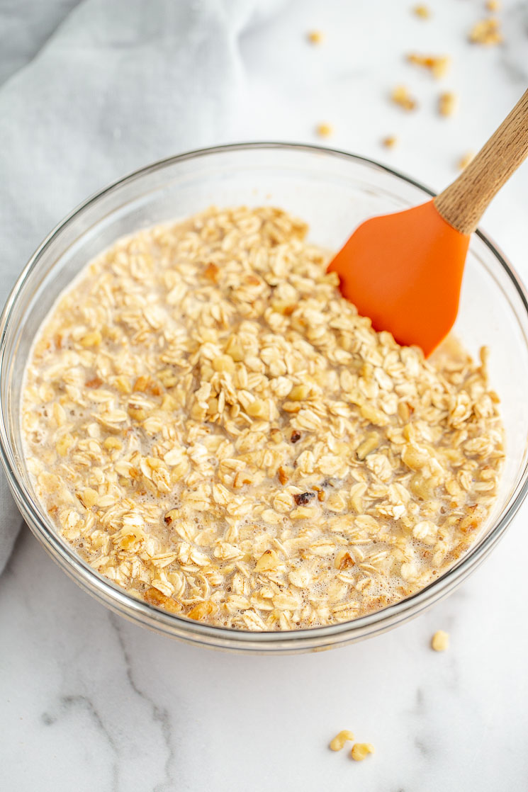 A glass mixing bowl with the banana oatmeal mixture.