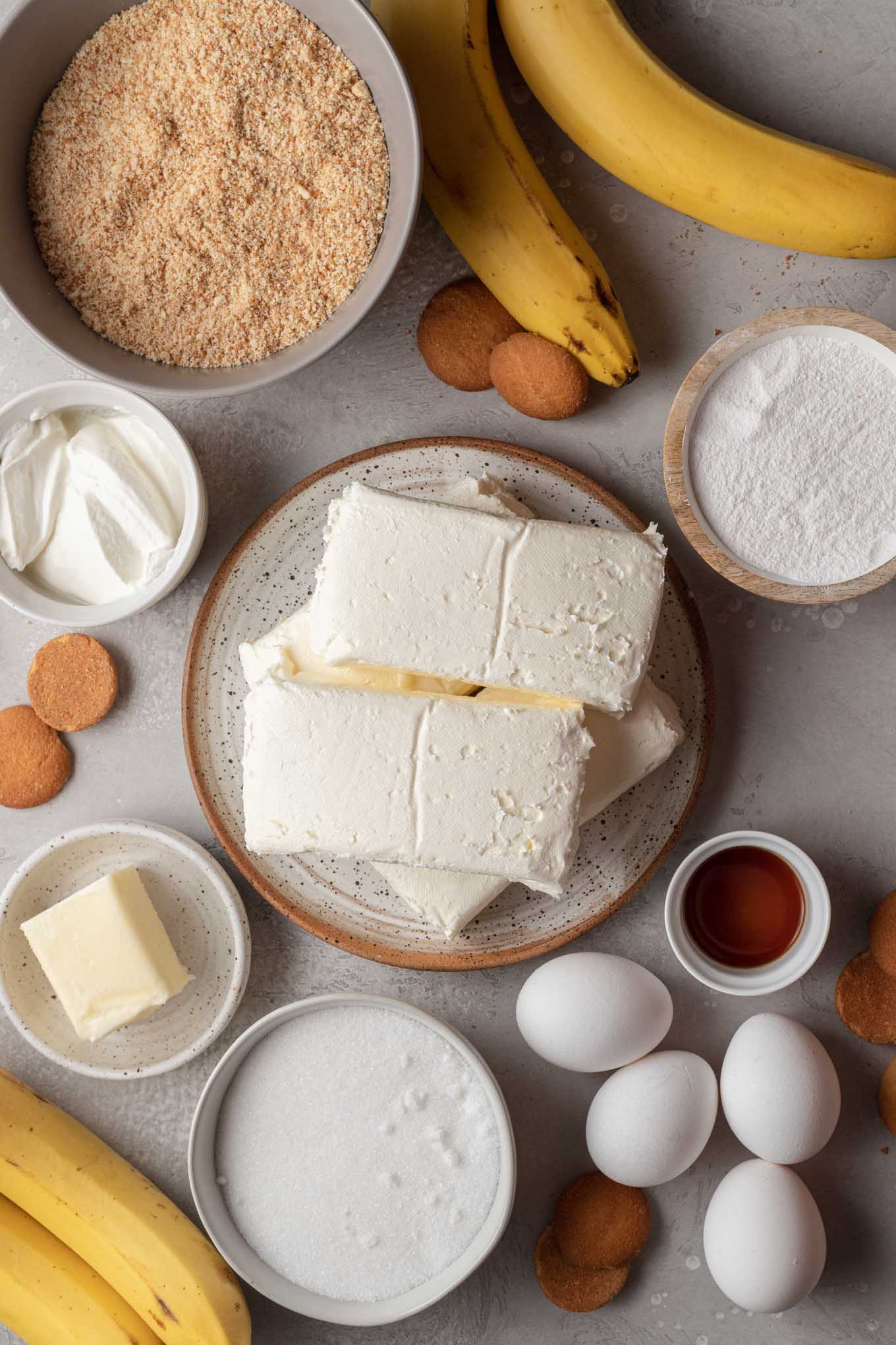 An overhead view of the ingredients needed to make banana cheesecake. 