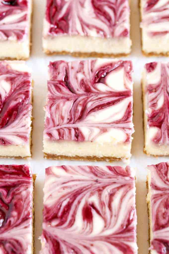 A homemade graham cracker crust topped with a smooth and creamy cheesecake filling and blackberry swirl. These Blackberry Swirl Cheesecake Bars make a gorgeous and delicious dessert!