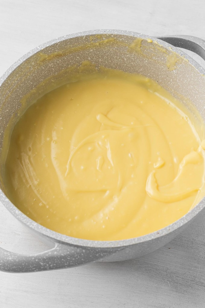 Thickened pastry cream in a saucepan.