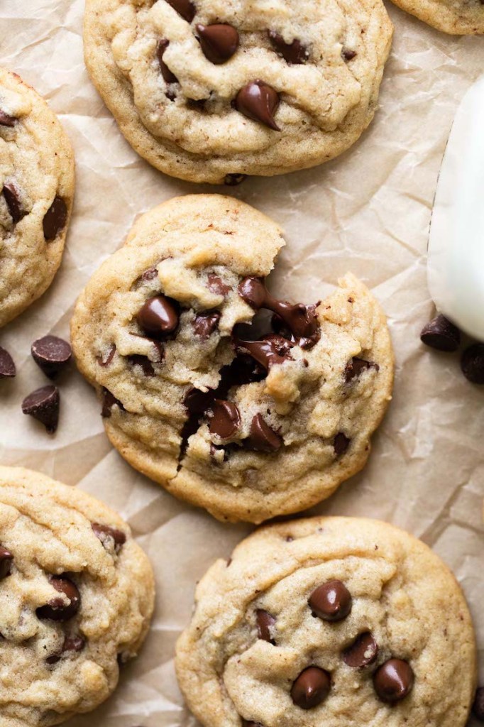 A close up image of some cookies showing the texture and melted chocolate chips.