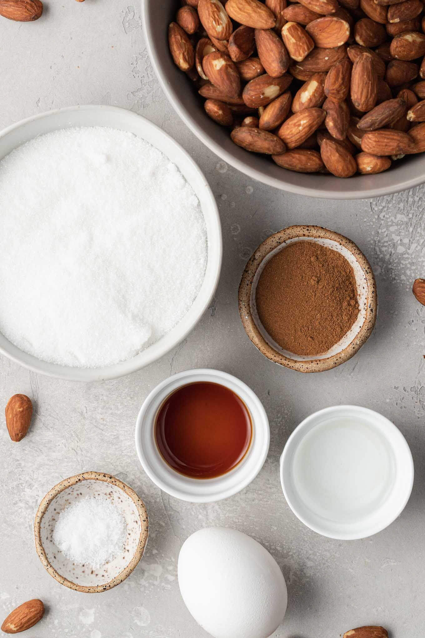 An overhead view of the ingredients needed to candy almonds. 