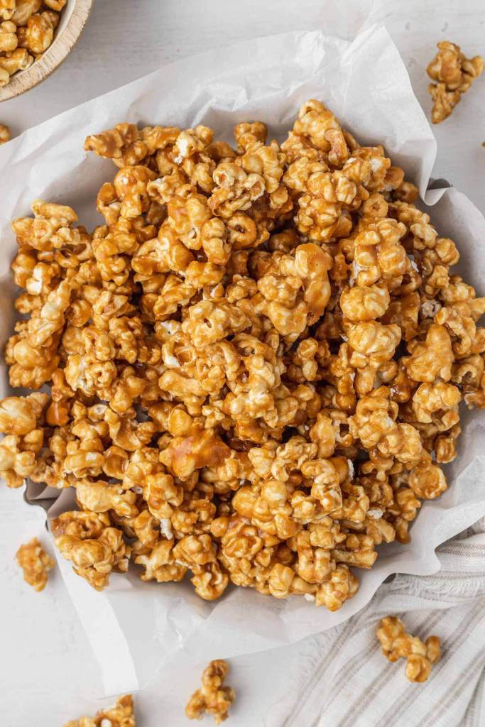 An overhead view of baked caramel corn in a metal tart pan. 