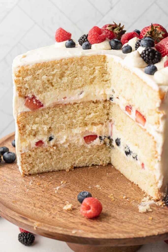 A side view of a sliced Chantilly cake, with the layers showing. 