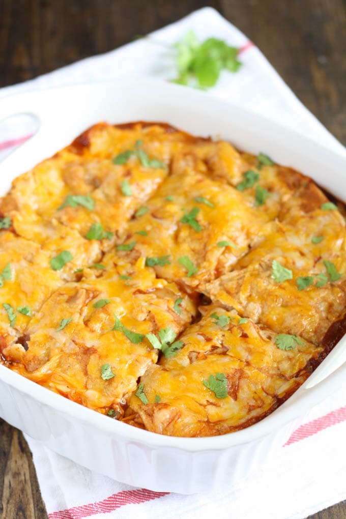 Chicken Enchilada Casserole in a white baking dish. 