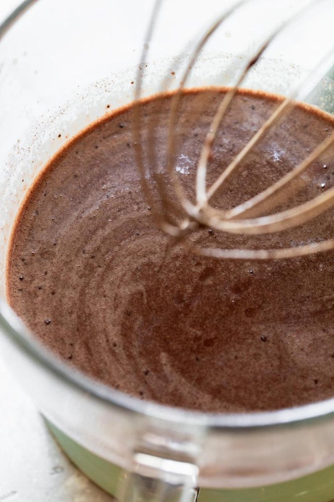 All of the ingredients needed for chocolate cake mixed together.