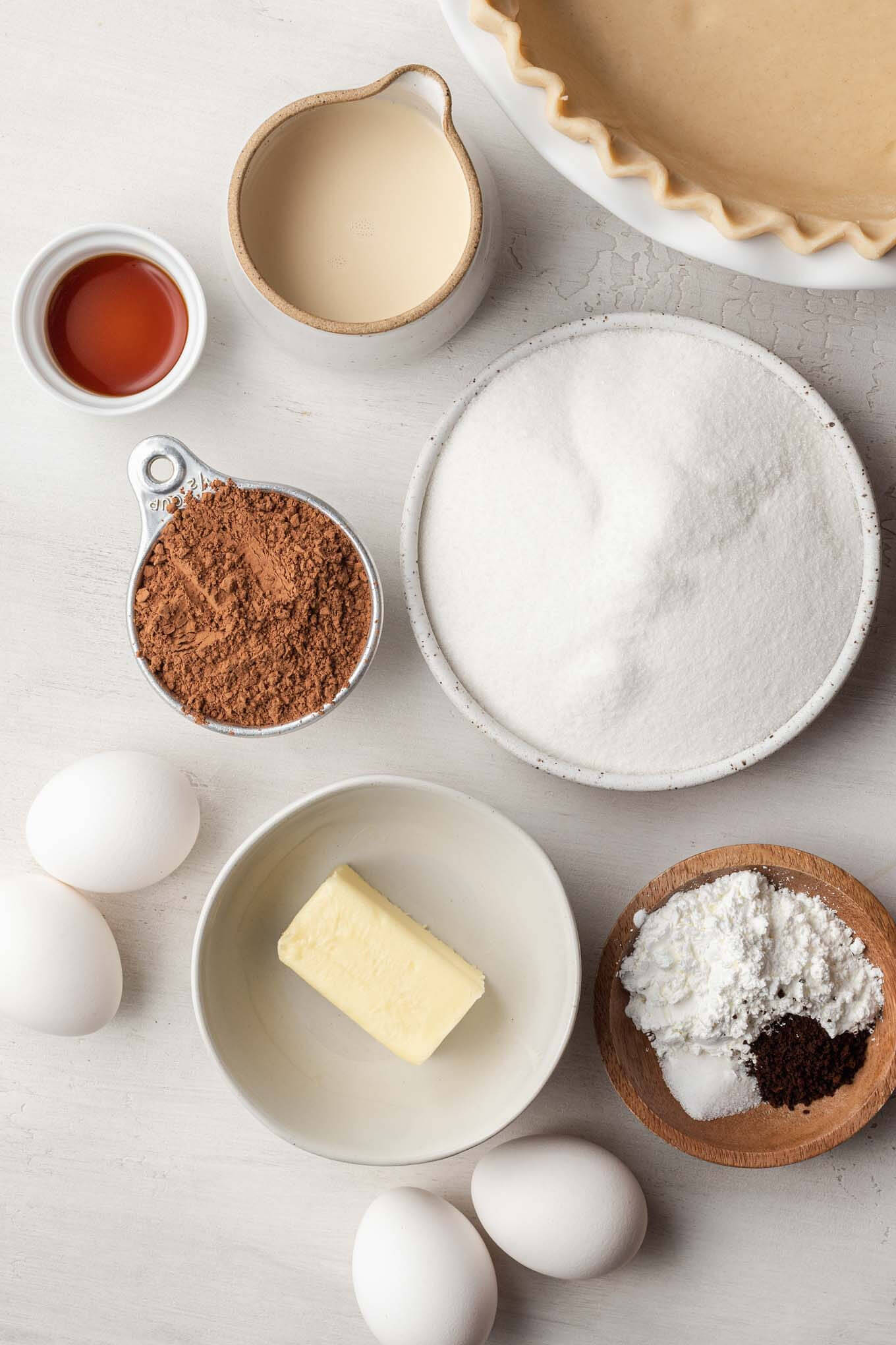 An overhead view of the ingredients needed to make chocolate chess pie. 