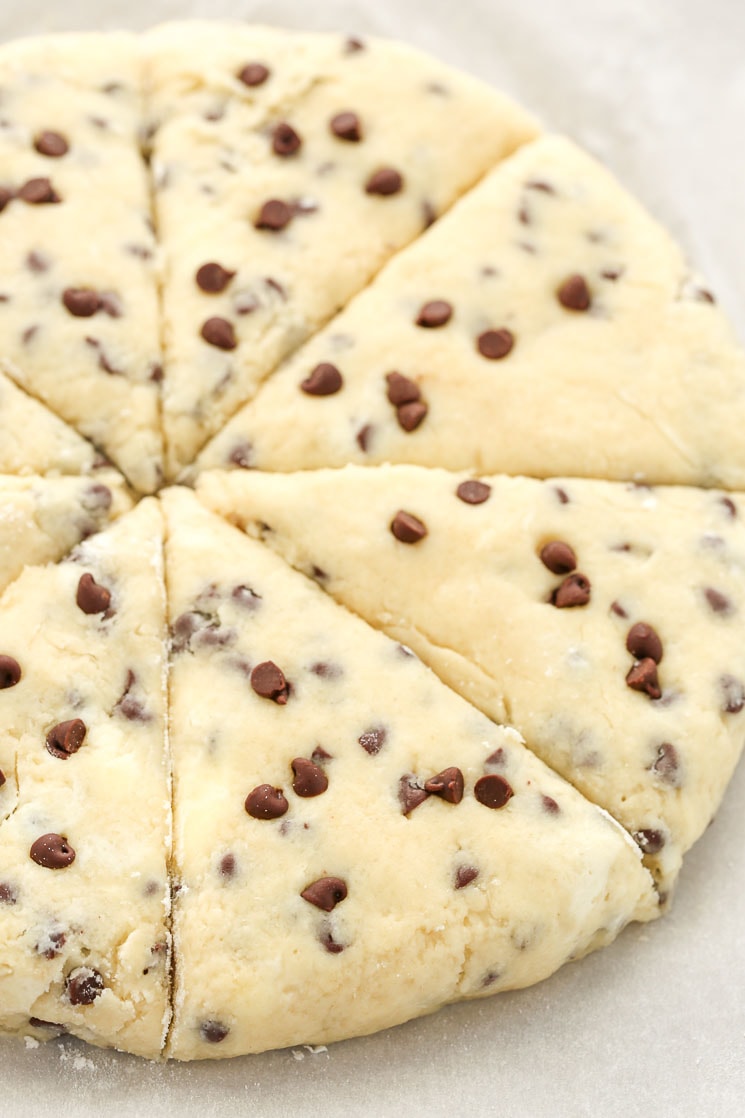 Raw scone dough that's been cut into 8 sections. 