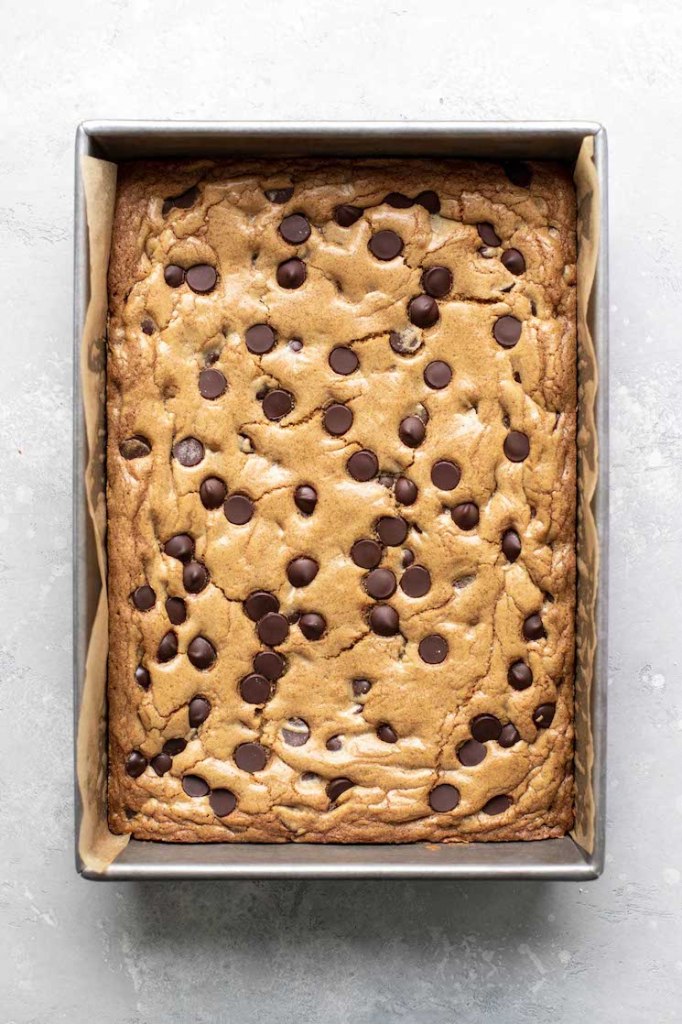 A pan of chocolate chip cookie bars, seen from above. 