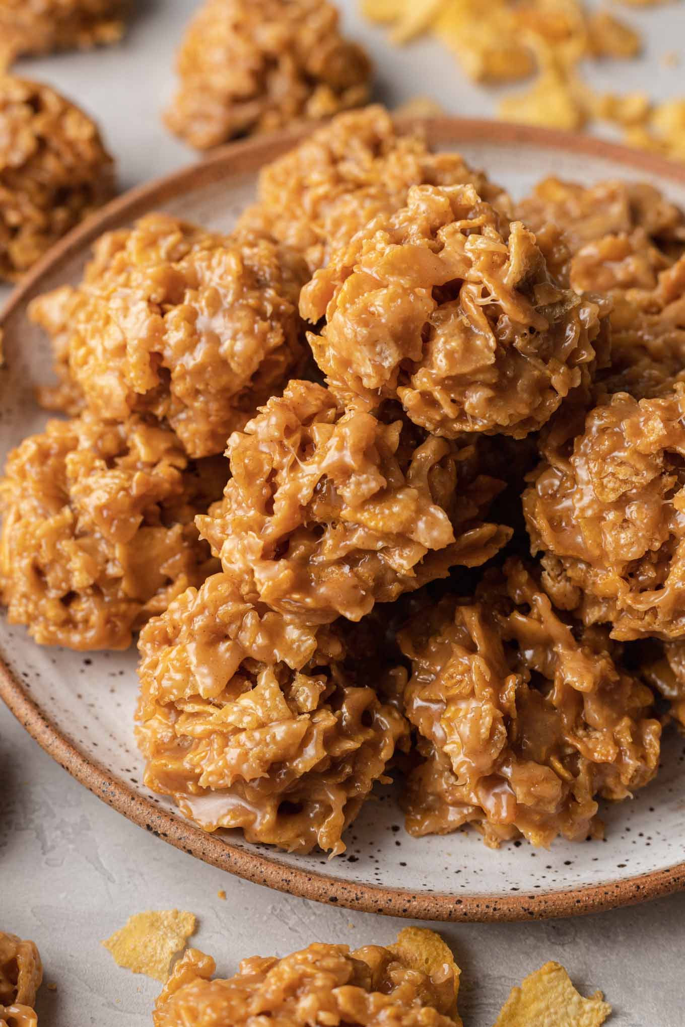 A plate piled high with cornflake cookies. 