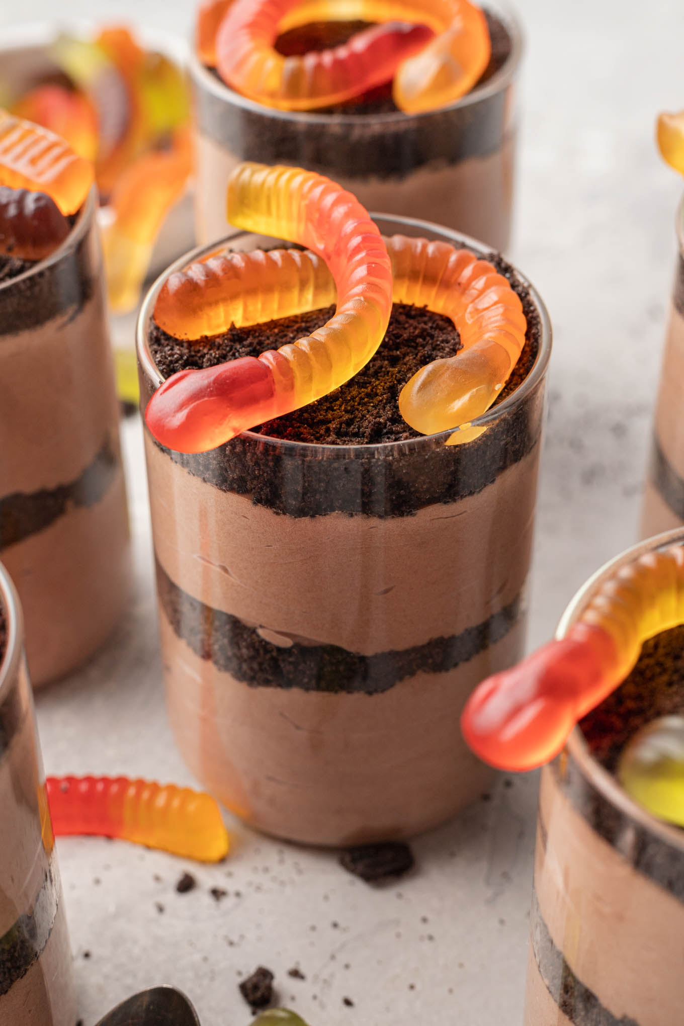 Dirt cups topped with gummy worms.
