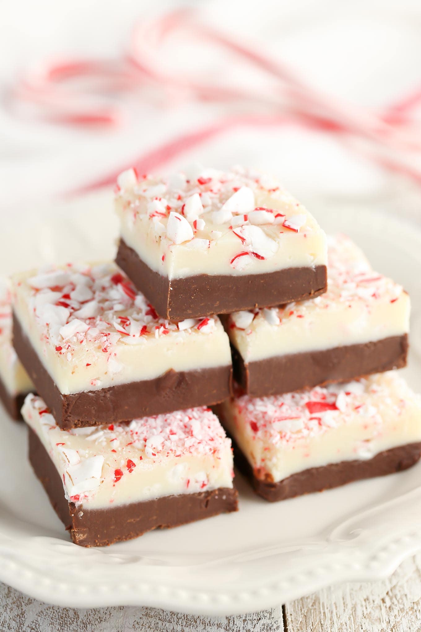 This Easy 5-Ingredient Peppermint Fudge features two layers of decadent fudge and is full of peppermint flavor. The perfect treat for Christmas!