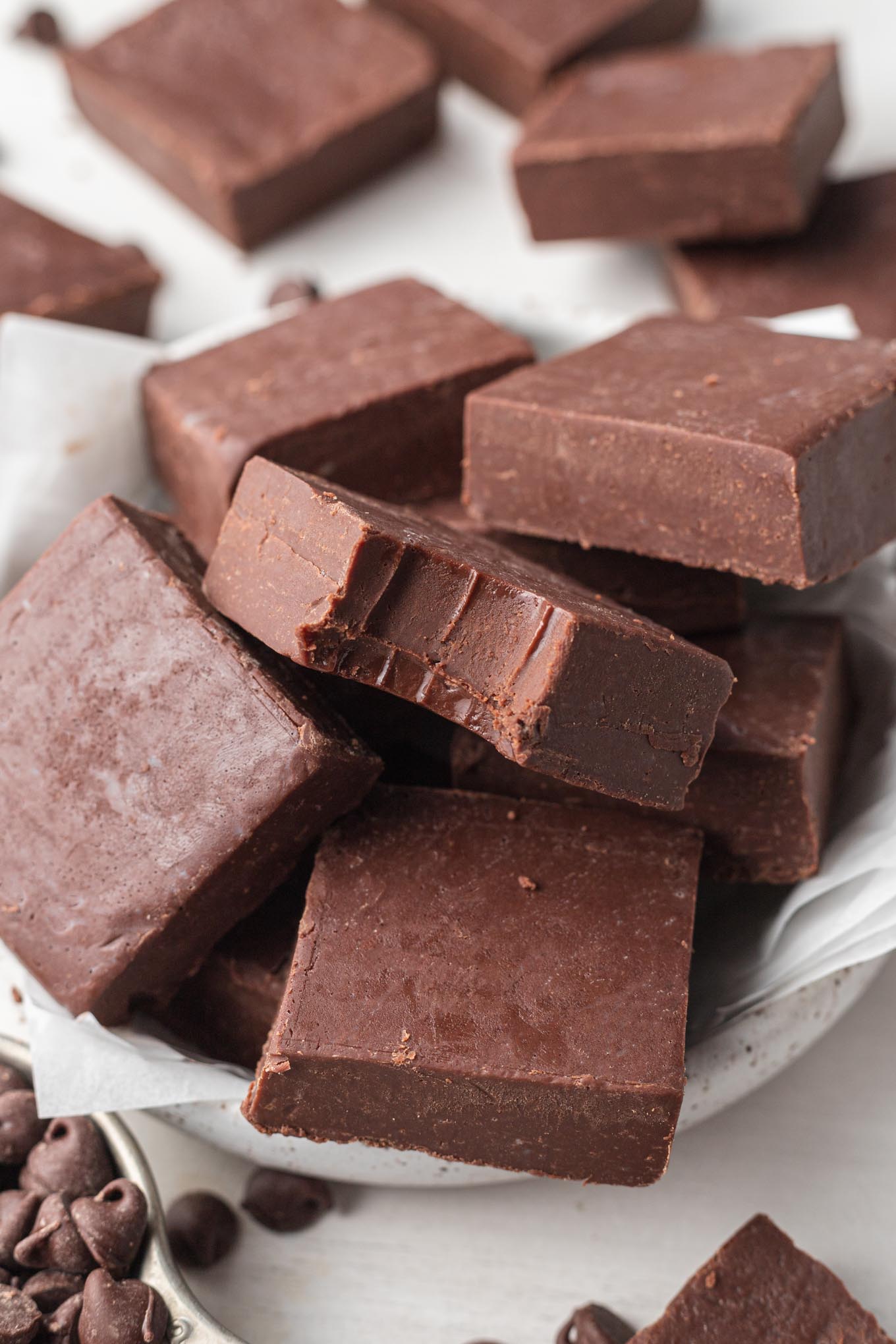 A small dish overflowing with slices of easy homemade fudge. 