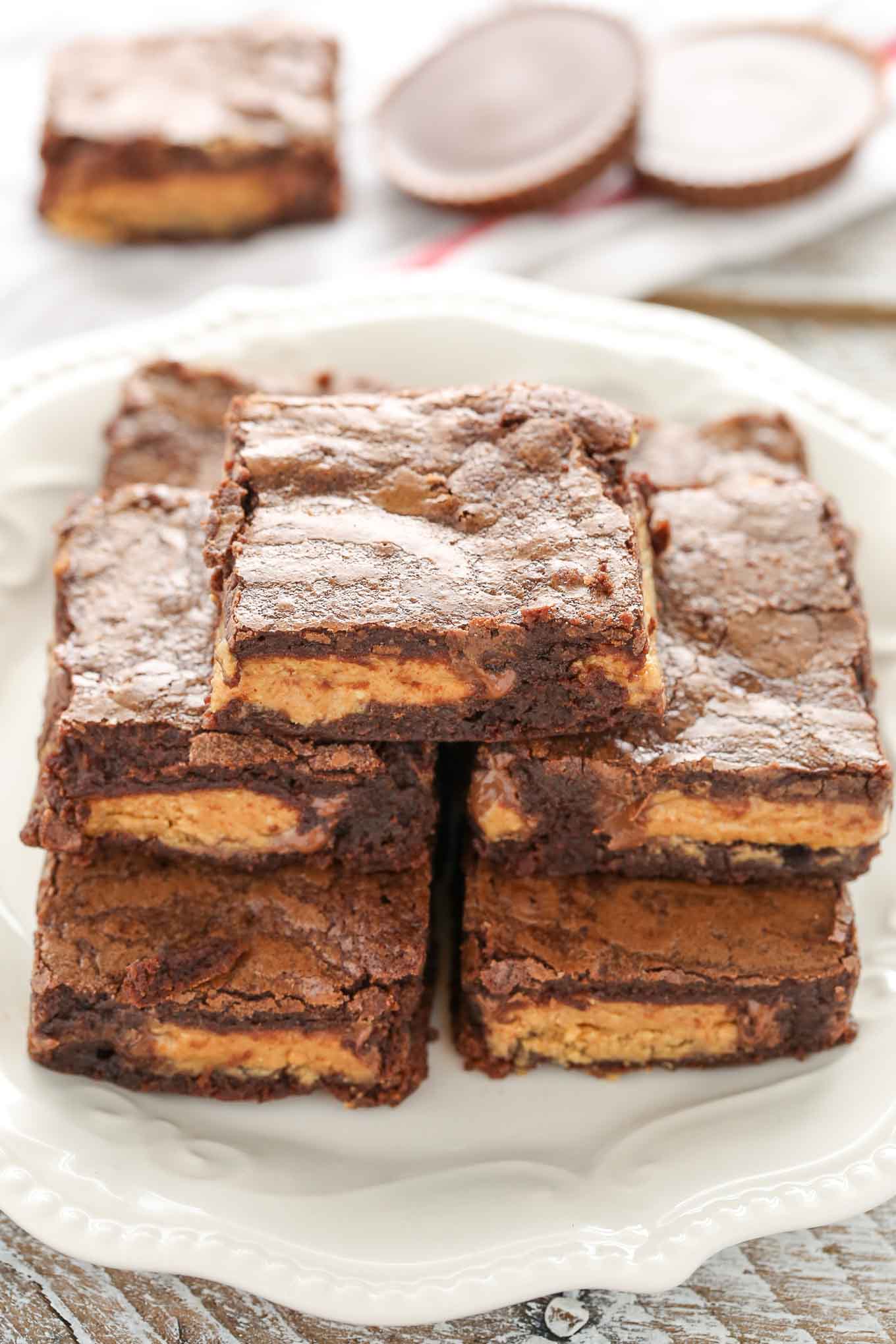 These Fudgy Peanut Butter Cup Brownies start with an easy homemade brownie recipe and are stuffed with peanut butter cups.  These fudgy brownies are the ultimate dessert!