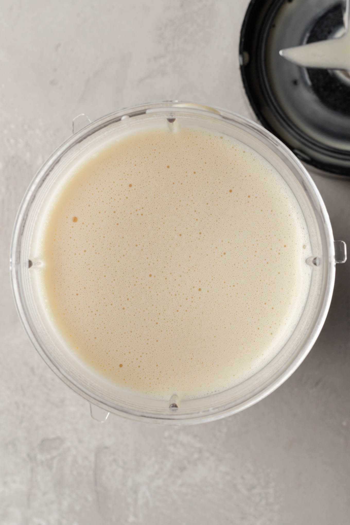 An overhead view of German pancake batter in a blender. 