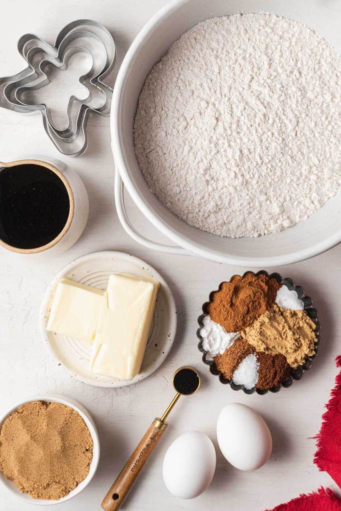 An overhead view of the ingredients needed to make gingerbread cutout cookies. 