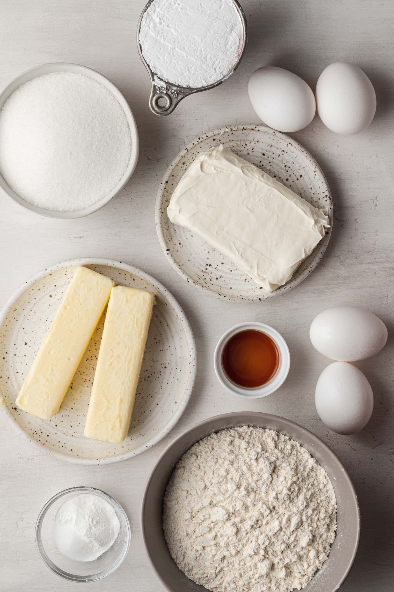 An overhead view of the ingredients needed to make a gooey butter cake recipe from scratch.