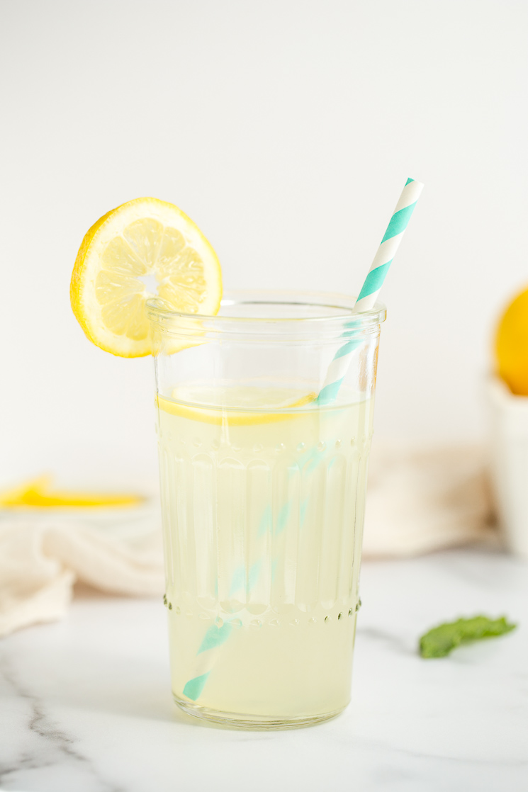 A closeup picture of a glass of lemonade.