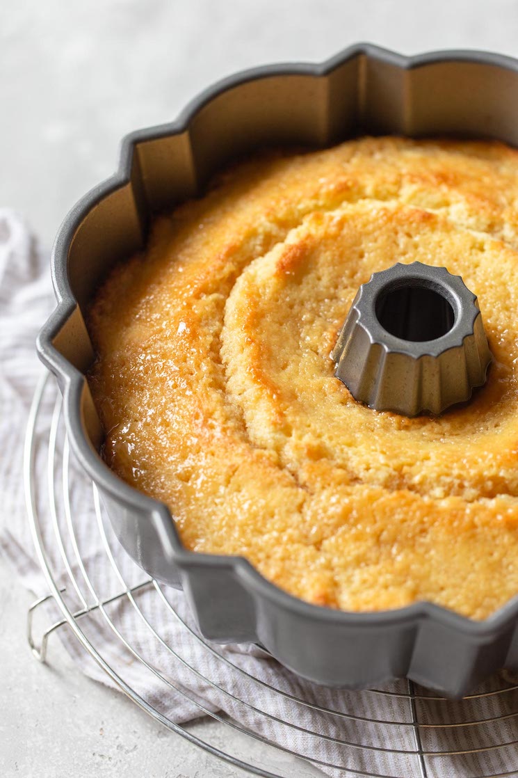 A close up of the finished cake with glazed poured over the top while still in the pan.