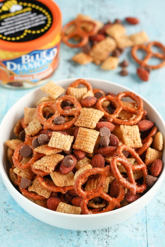 An easy to make snack mix filled with honey, pretzels, chocolate, almonds, and more! This Honey Almond Snack Mix makes a perfect snack for any party or occasion!