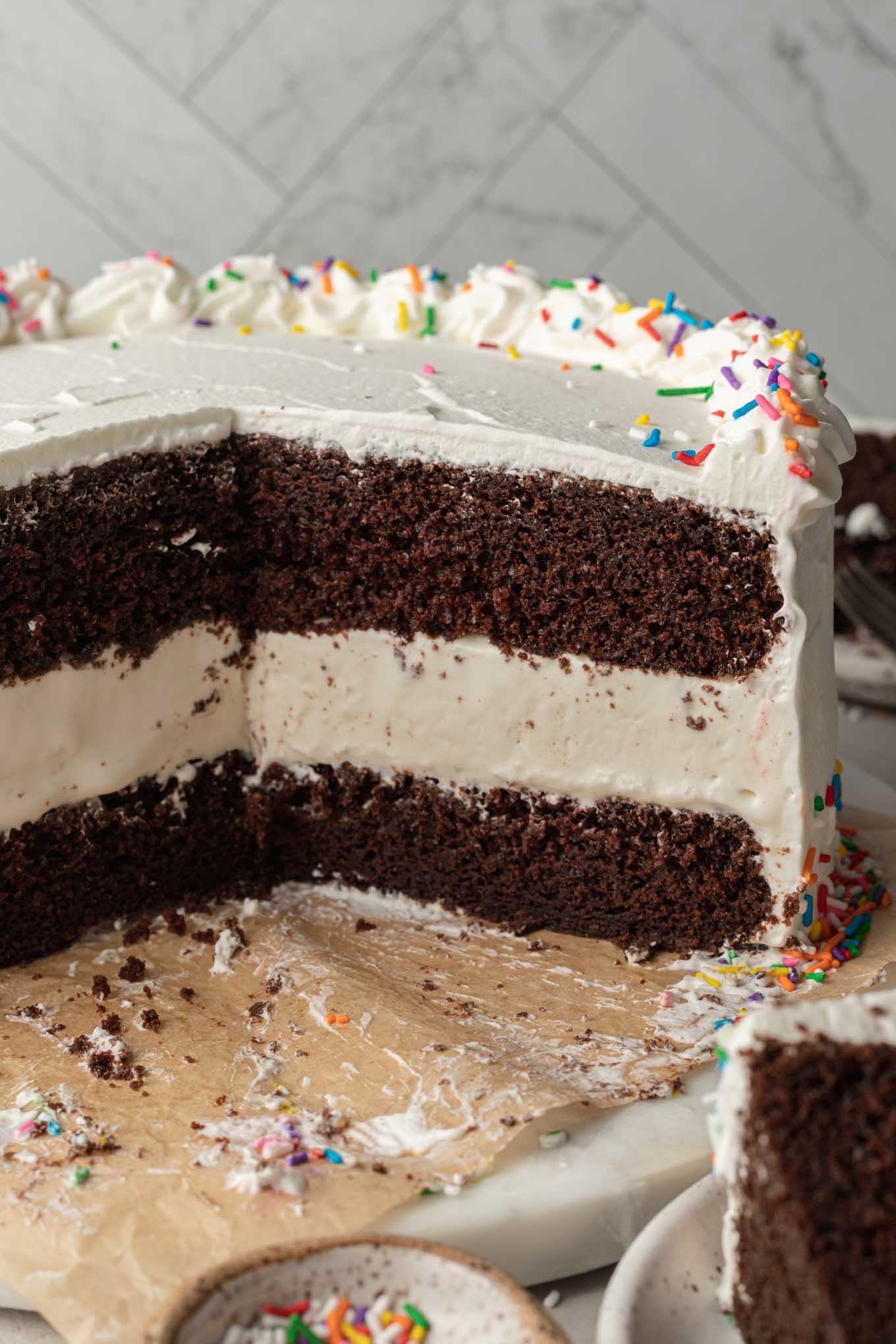 A sliced ice cream cake on a cake stand.