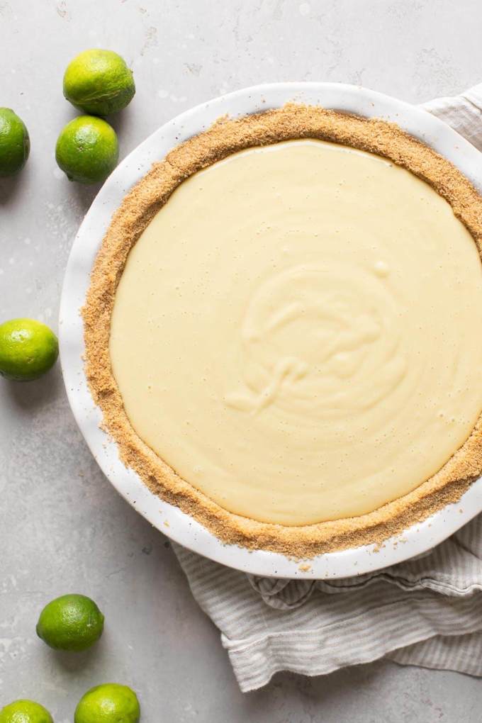 Overhead view of an unbaked key lime pie.