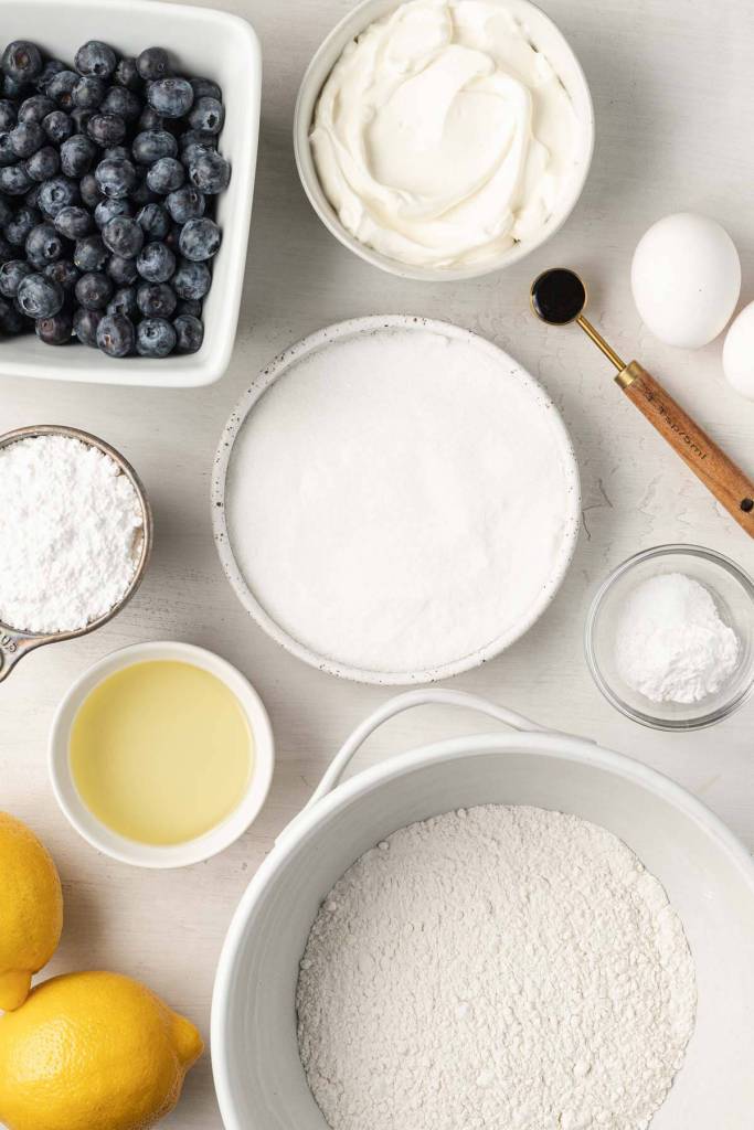 An overhead view of the ingredients needed to make blueberry lemon bread with lemon glaze. 