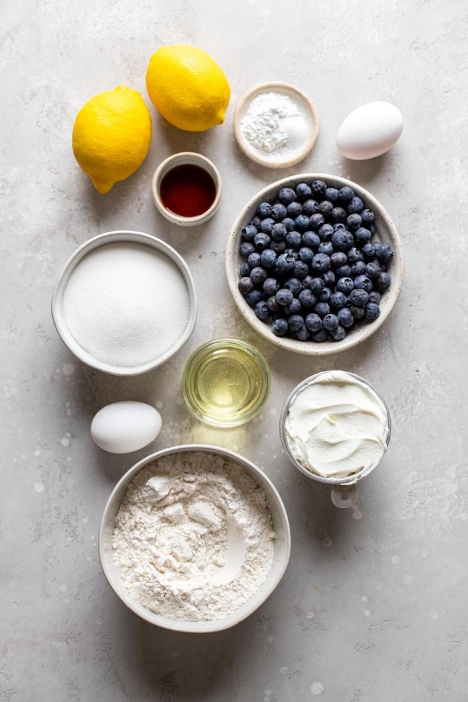 Overhead view of the ingredients needed to make lemon blueberry muffins with sour cream. 