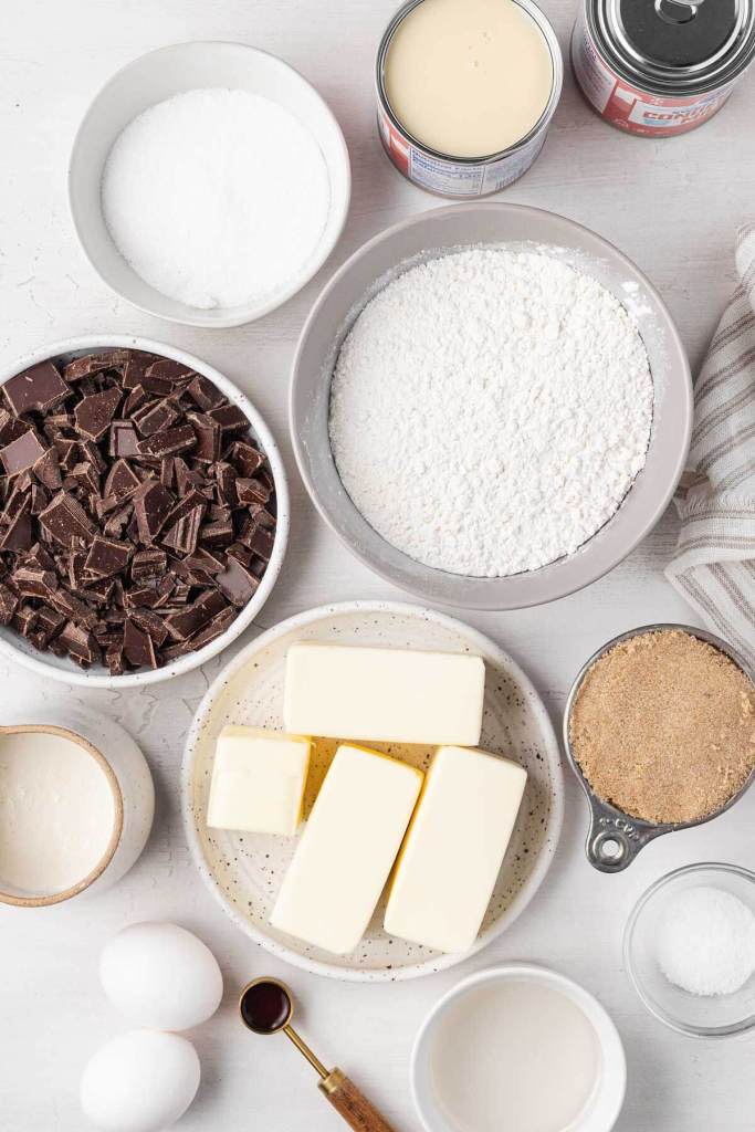 An overhead view of the ingredients needed to make millionaire shortbread. 