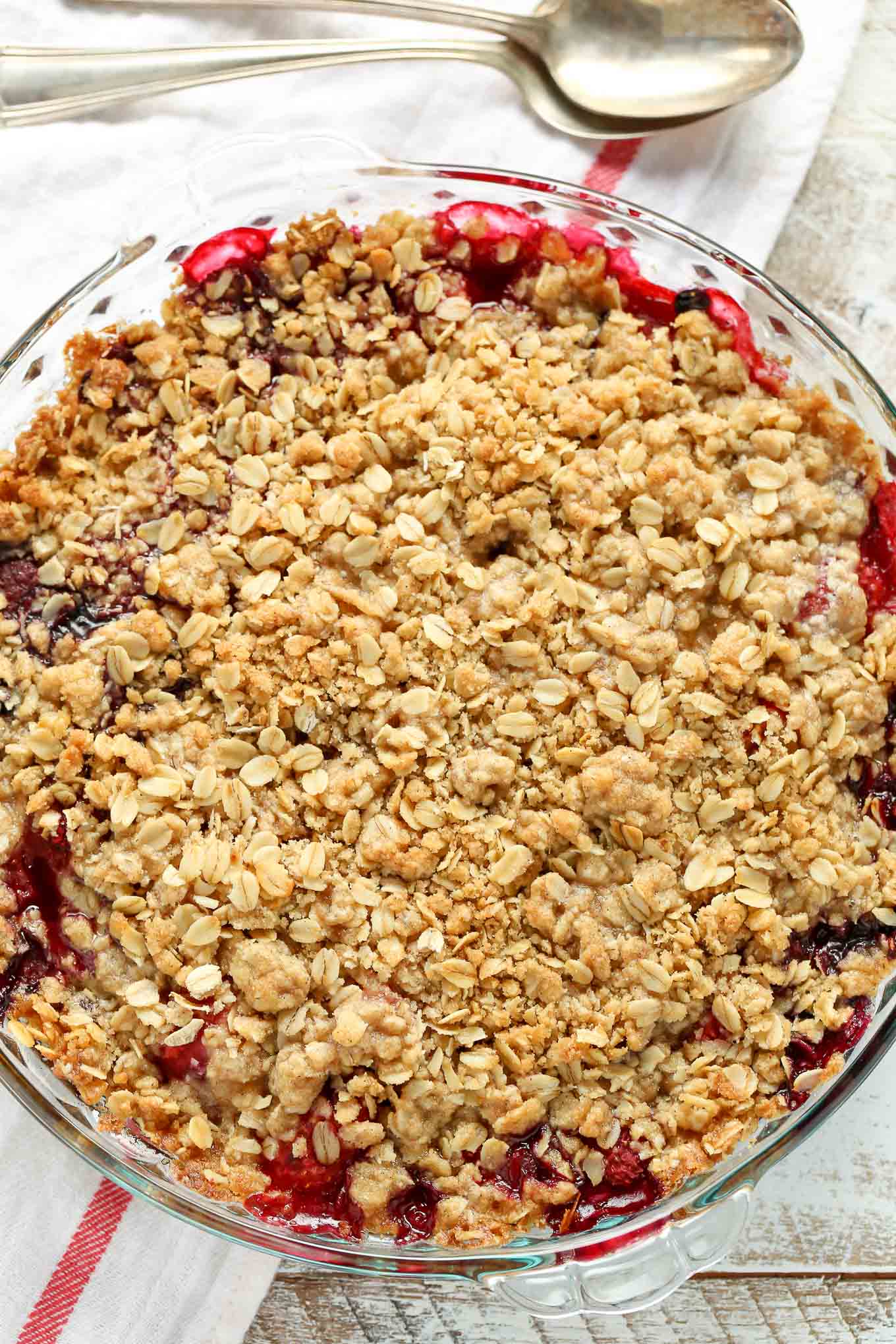 A mixed berry crisp in a glass pie plate, seen from above. 