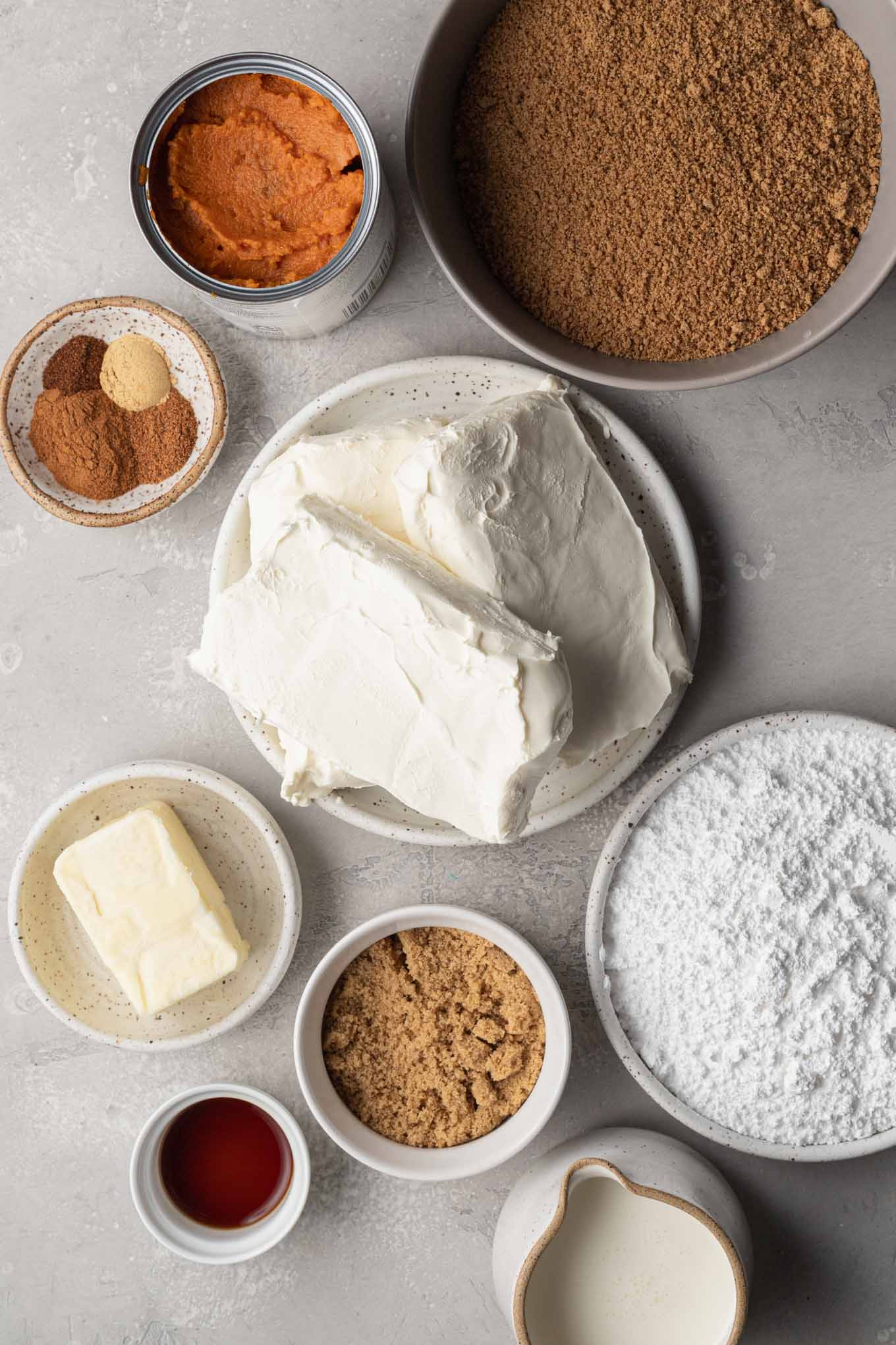 An overhead view of the ingredients in a pumpkin no-bake cheesecake. 