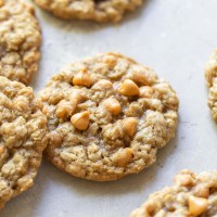 Oatmeal Scotchies on top of a rustic gray surface.