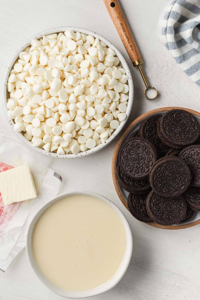 An overhead view of the ingredients needed to make cookies and cream fudge. 