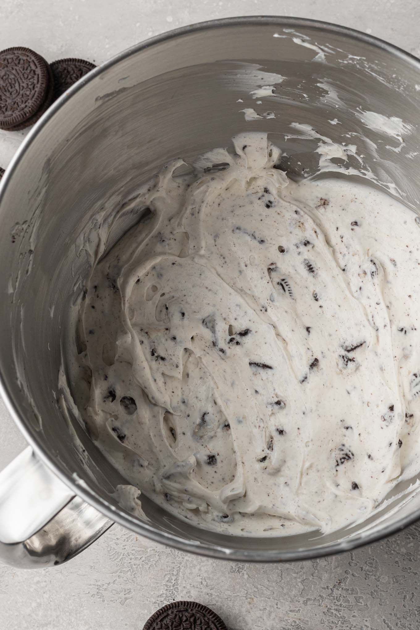 Oreo pie filling mixed together in the bowl of a stand mixer.