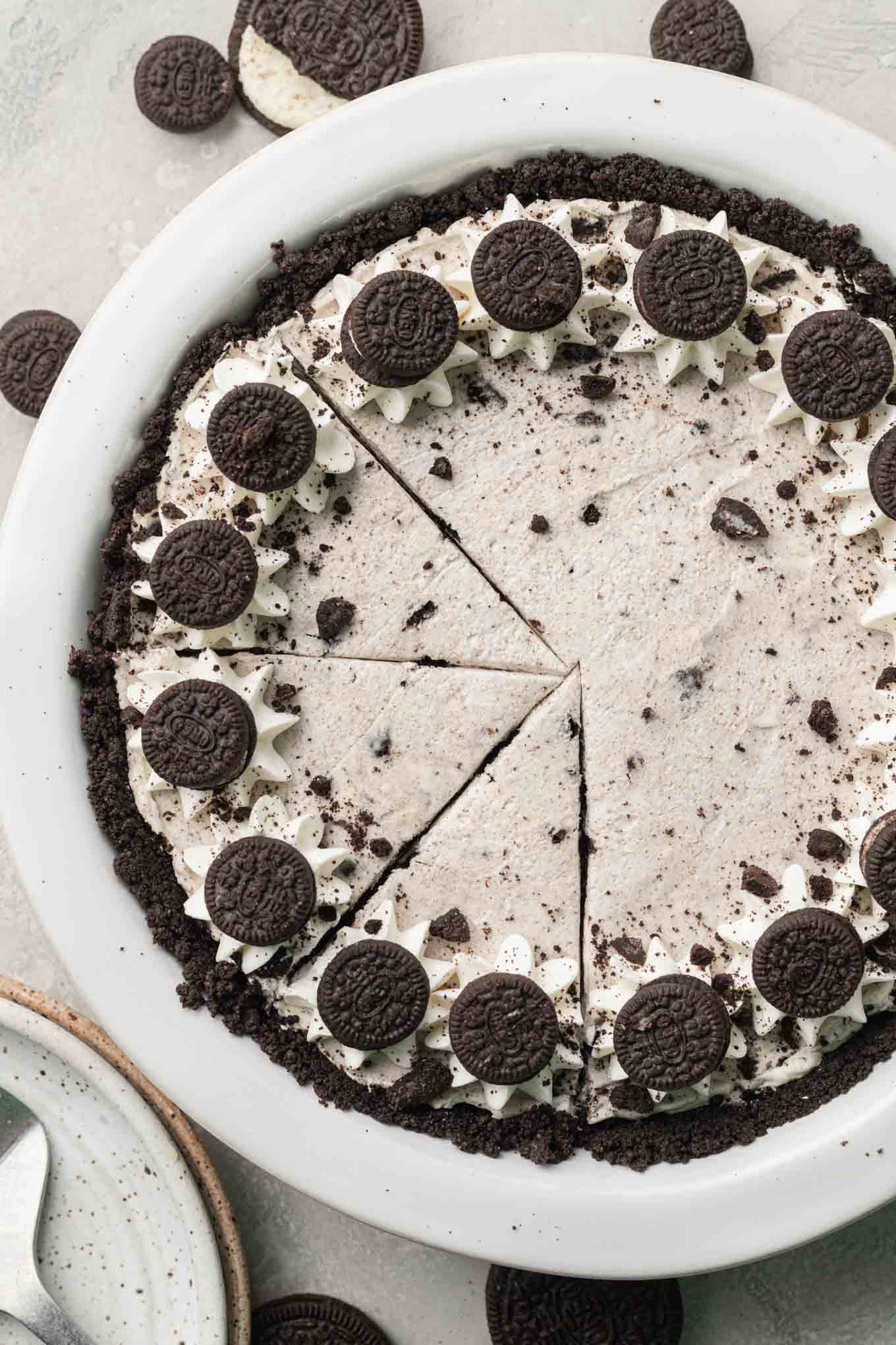 An overhead view of a sliced Oreo pie.