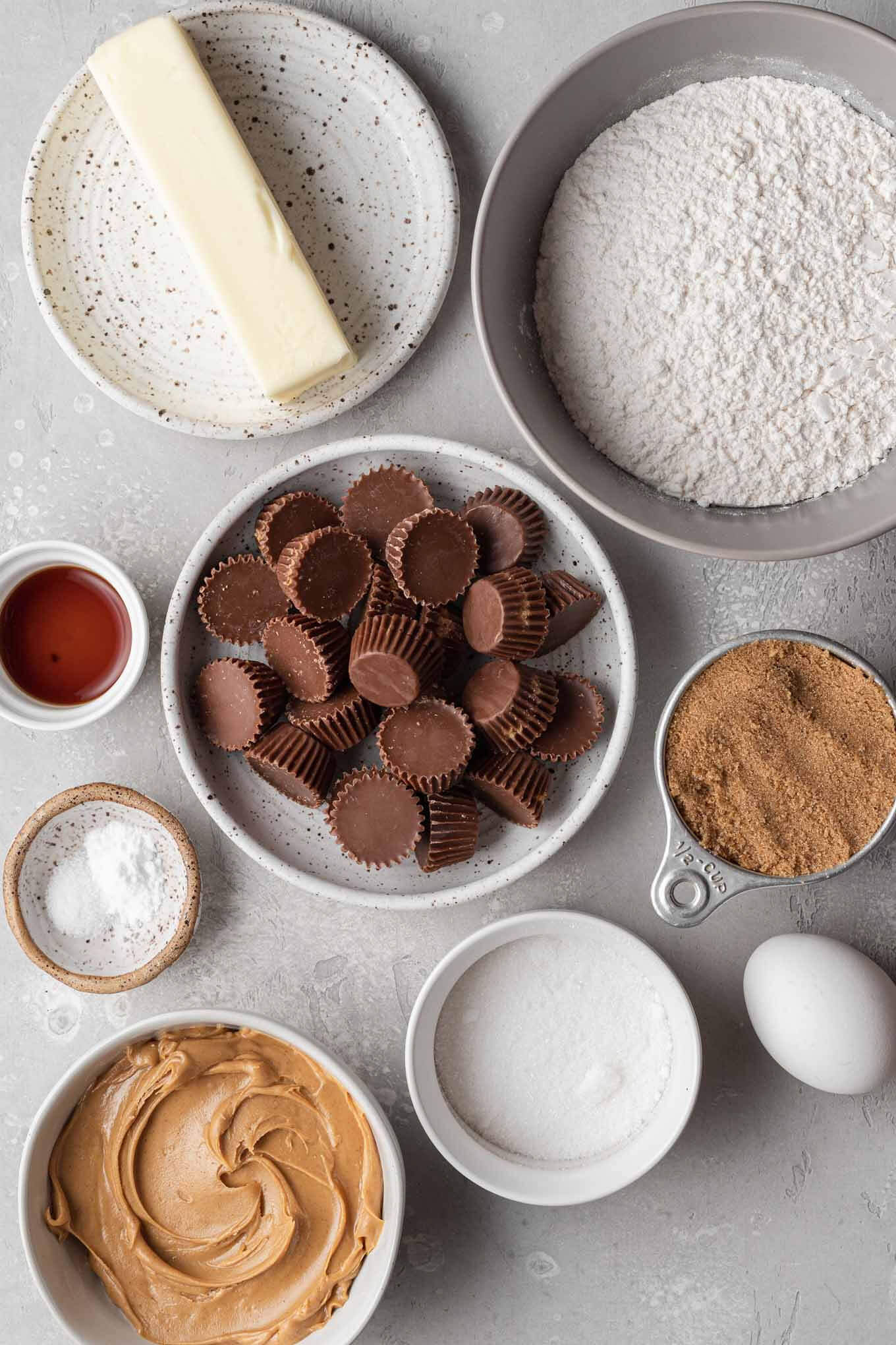 An overhead view of the ingredients needed to make peanut butter cookies with Reese's cups. 