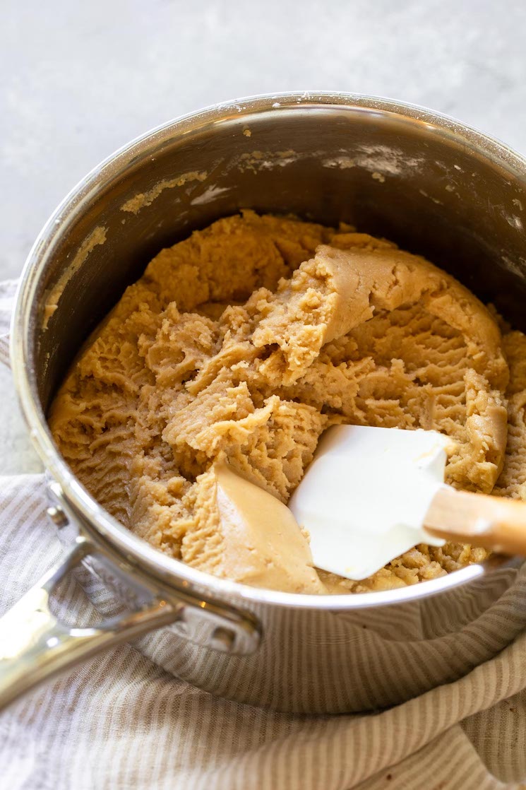 Peanut butter fudge mixed up in a sauce pan.