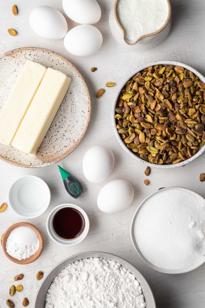 An overhead view of the ingredients needed to make a pistachio cake.