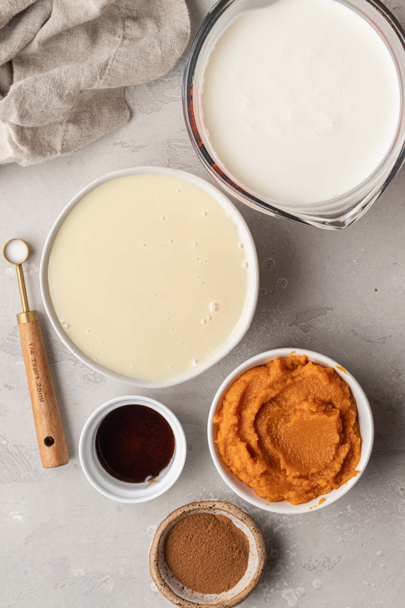 An overhead view of the ingredients needed to make no-churn pumpkin spice ice cream. 