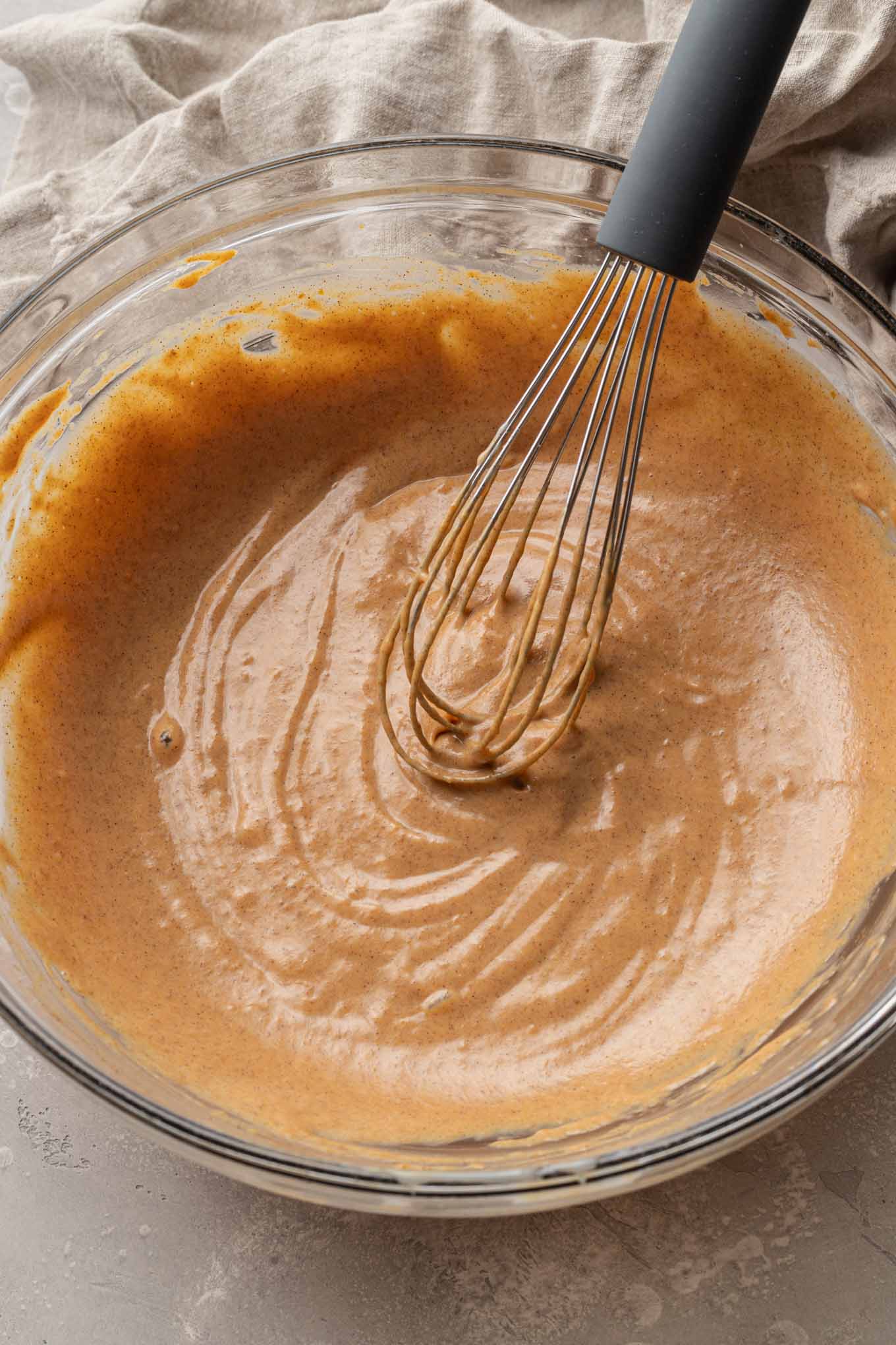 An overhead view of a pumpkin puree mixture being prepared for ice cream. 