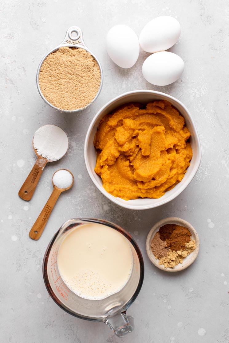 An overhead view of the ingredients needed to make pumpkin pie filling. 