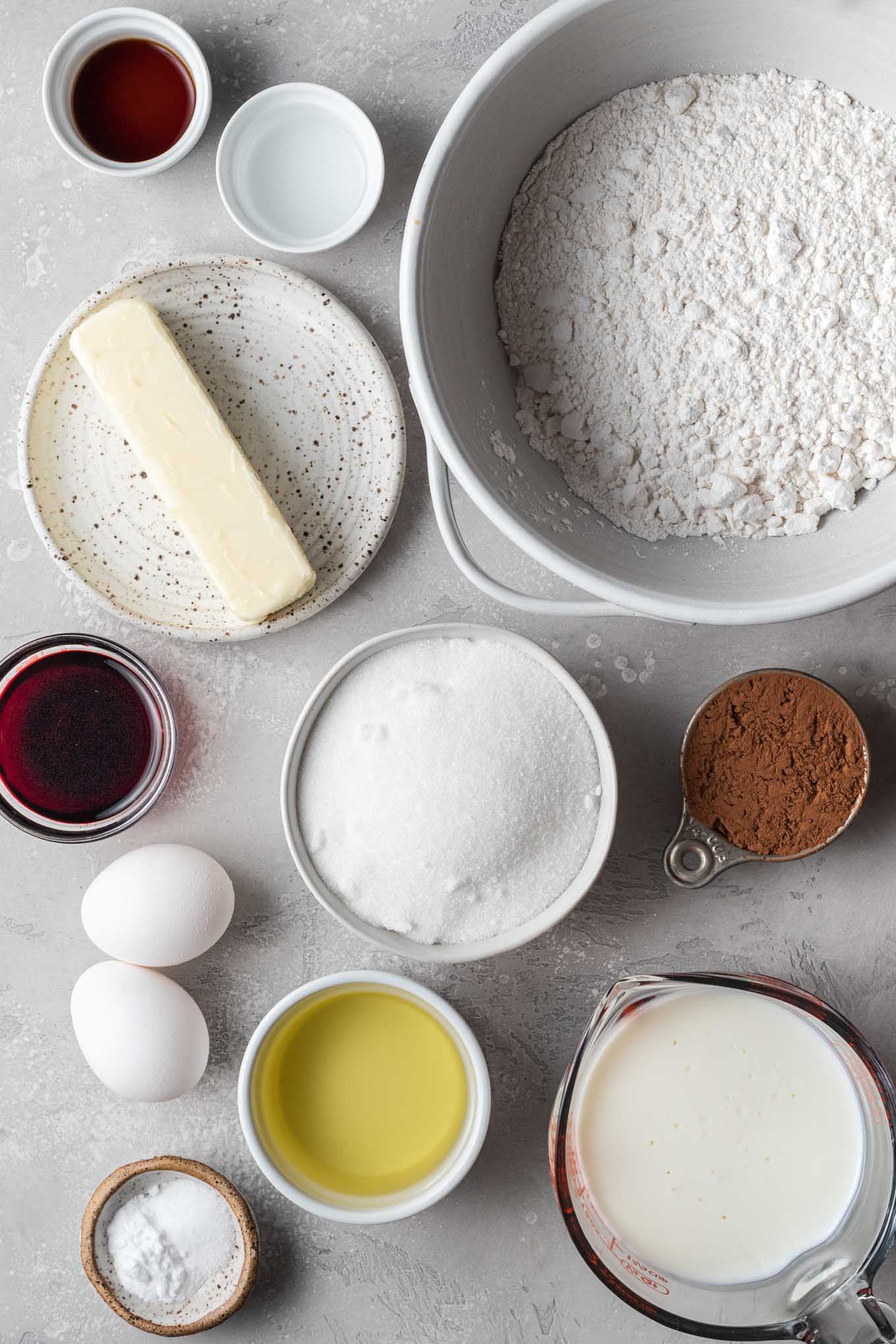 An overhead view of the ingredients needed for homemade red velvet cake. 