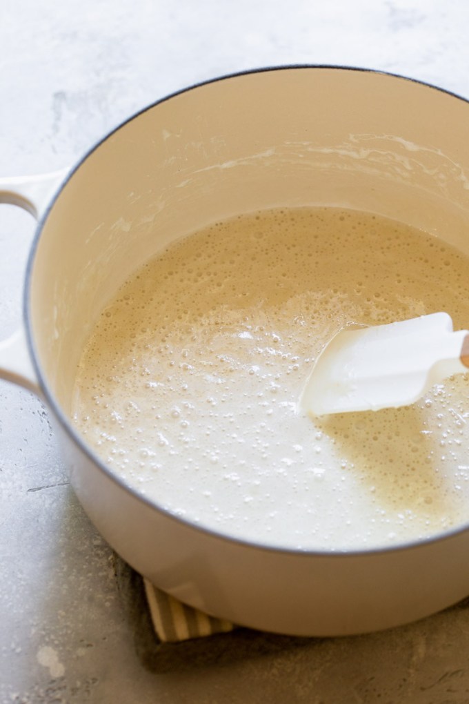 A dutch oven with butter and marshmallow melted down.