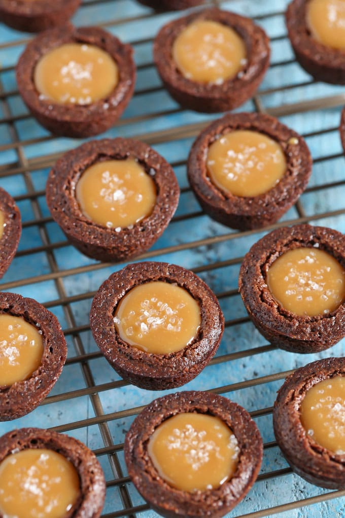 Salted caramel brownie bites on a cooling rack. 