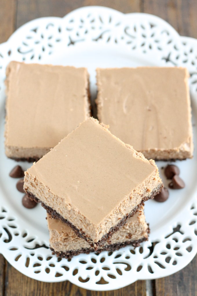 These Skinny Mocha Cheesecake Bars are lightened up with Greek yogurt and less sugar! Serve these bars for an easy and lighter dessert.