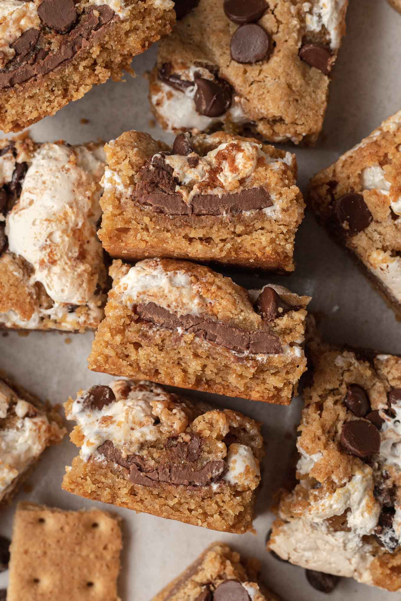 An overhead view of s'mores bars. Three are turned on their sides, surrounded by additional bars. 