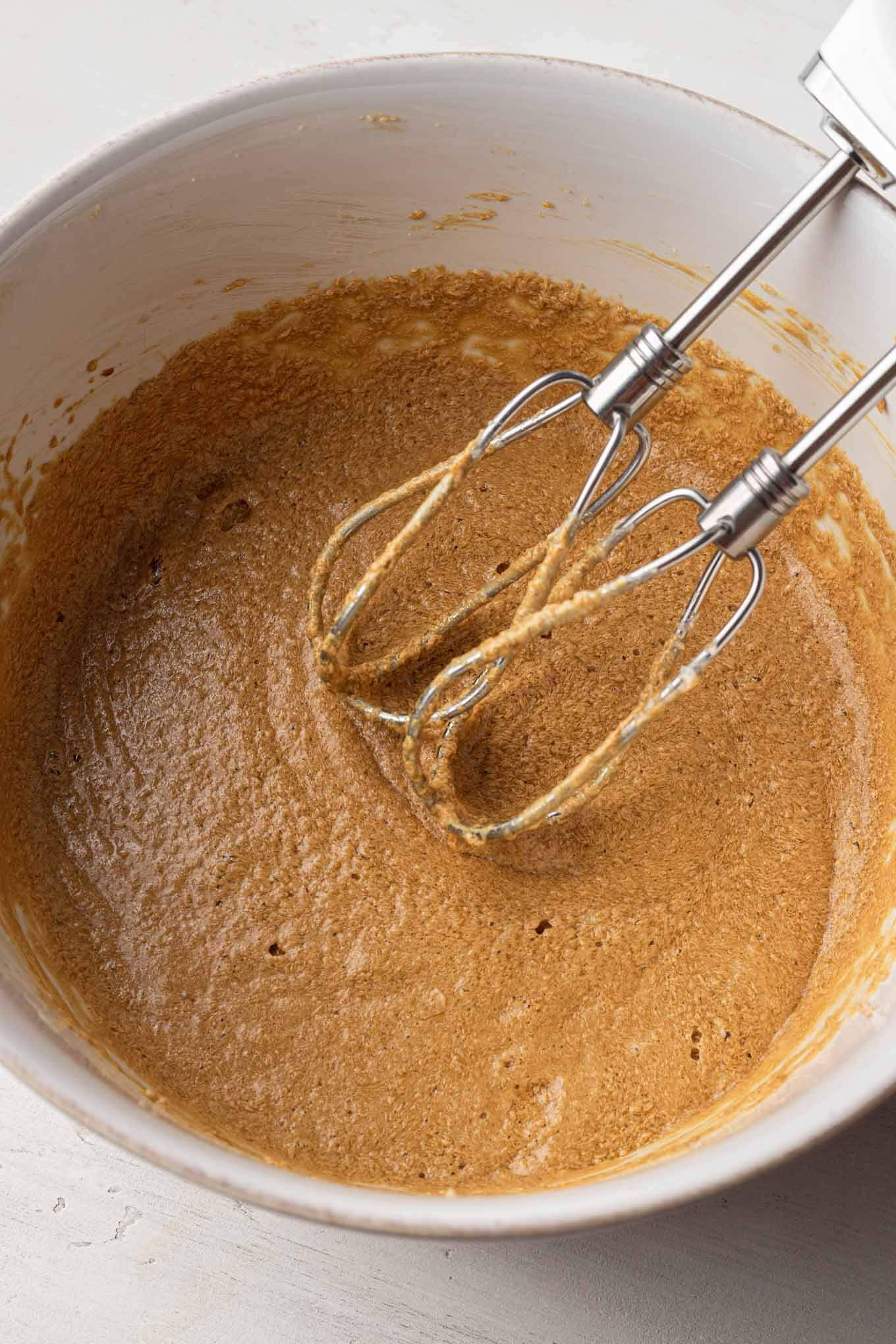 Overhead view of the wet ingredients for the cake batter mixed together.